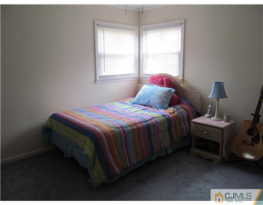 1 Timber Road East Brunswick, NJ 08816 - Photo 14 of 22 a bedroom with a bed and a window