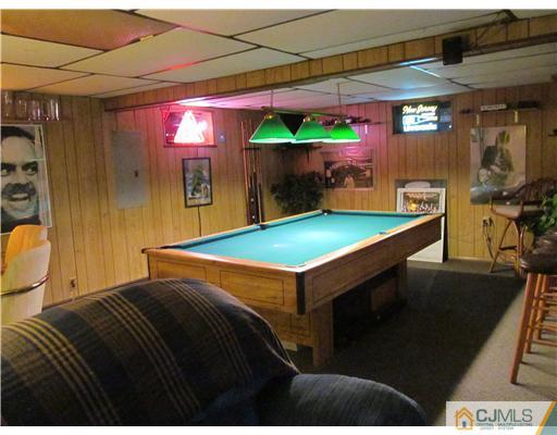 1 Timber Road East Brunswick, NJ 08816 - Photo 18 of 22 a room with pool table table and chairs in it