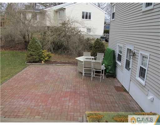 1 Timber Road East Brunswick, NJ 08816 - Photo 21 of 22 a view of a patio with table and chairs and potted plants