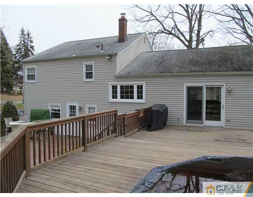 1 Timber Road East Brunswick, NJ 08816 - Photo 22 of 22 a view of a house with a patio and a yard