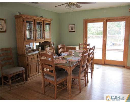 1 Timber Road East Brunswick, NJ 08816 - Photo 5 of 22 a view of a dining room with furniture and wooden floor