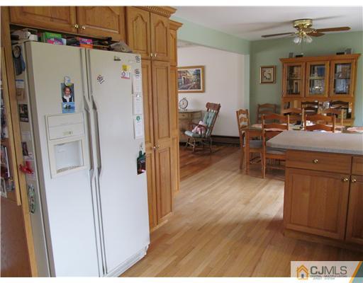 1 Timber Road East Brunswick, NJ 08816 - Photo 8 of 22 a living room with furniture and a refrigerator