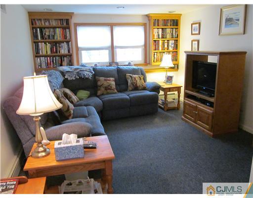 1 Timber Road East Brunswick, NJ 08816 - Photo 10 of 22 a living room with furniture and a flat screen tv