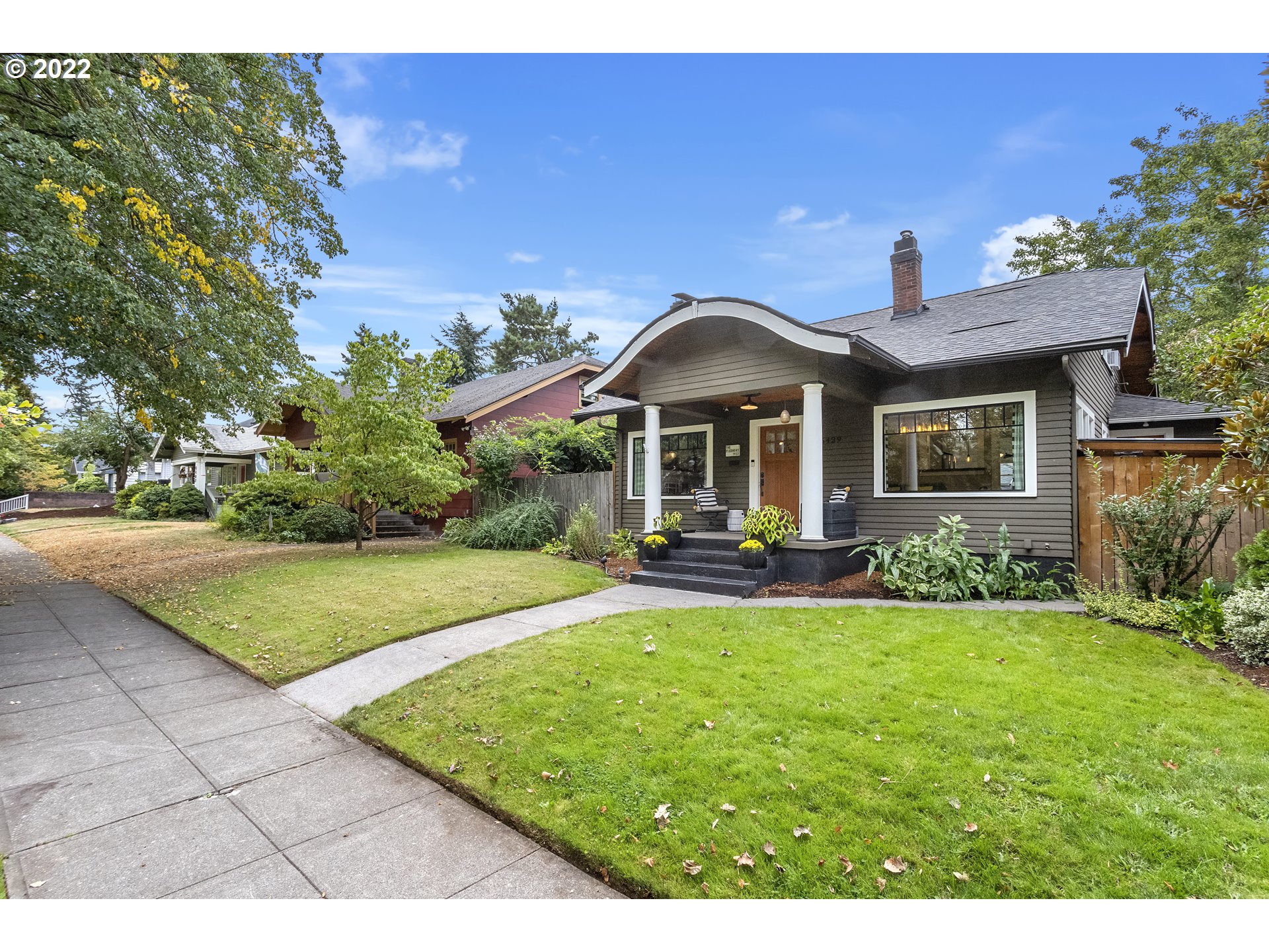 6429 North Commercial Avenue Portland, OR 97217 - Photo 1 of 32 a front view of a house with a yard