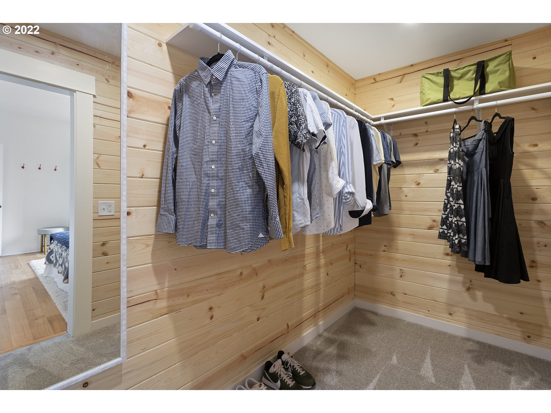 6429 North Commercial Avenue Portland, OR 97217 - Photo 13 of 32 a view of walk in closet with clothes and shoes