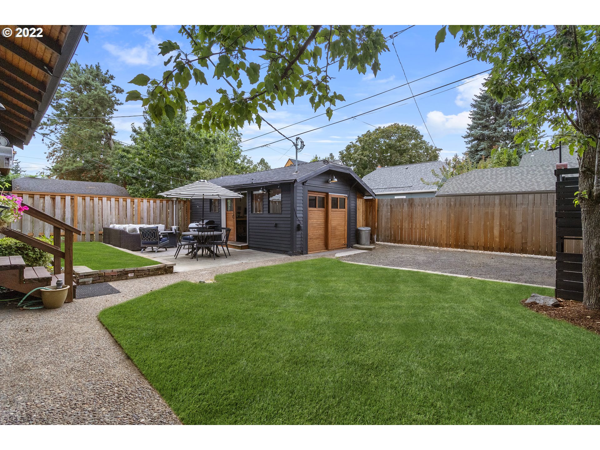 6429 North Commercial Avenue Portland, OR 97217 - Photo 15 of 32 a view of a house with backyard and sitting area