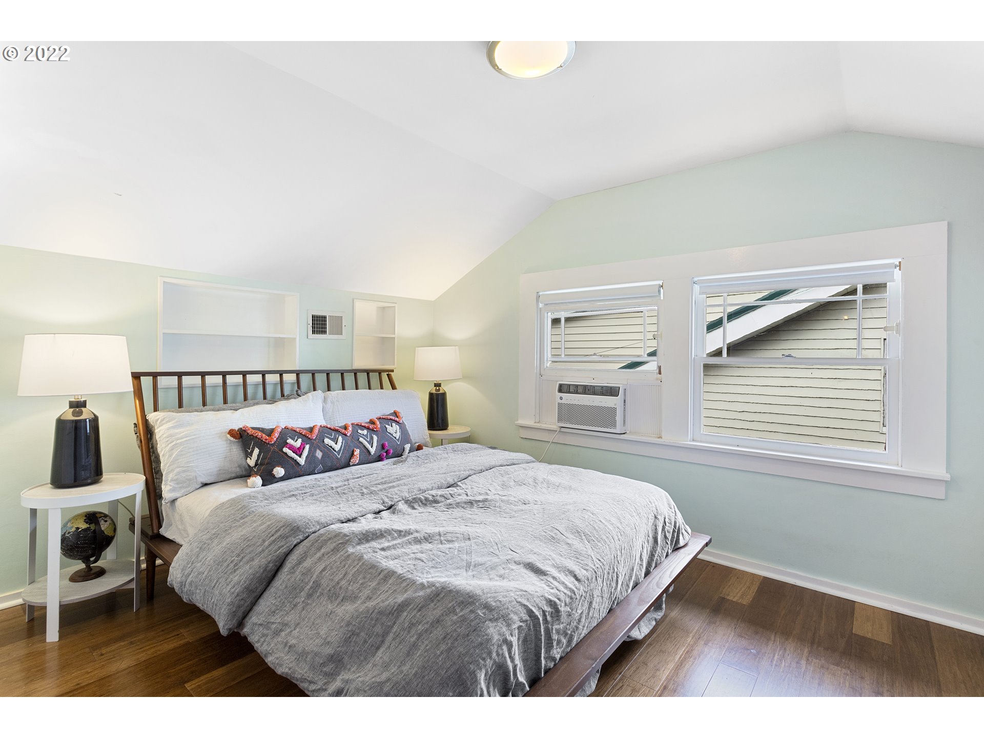 6429 North Commercial Avenue Portland, OR 97217 - Photo 20 of 32 a bedroom with a bed and a window