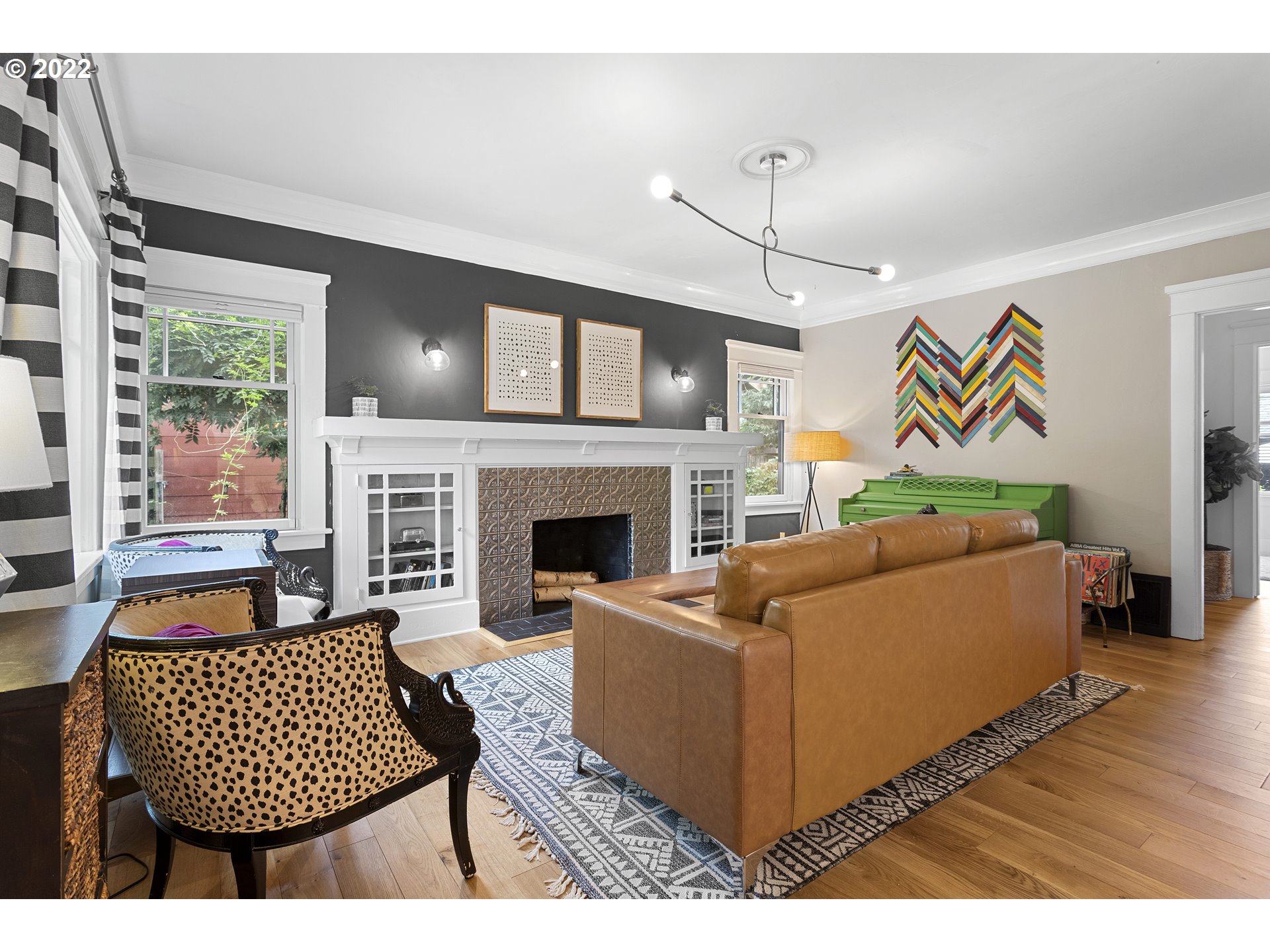 6429 North Commercial Avenue Portland, OR 97217 - Photo 4 of 32 a living room with furniture and a fireplace