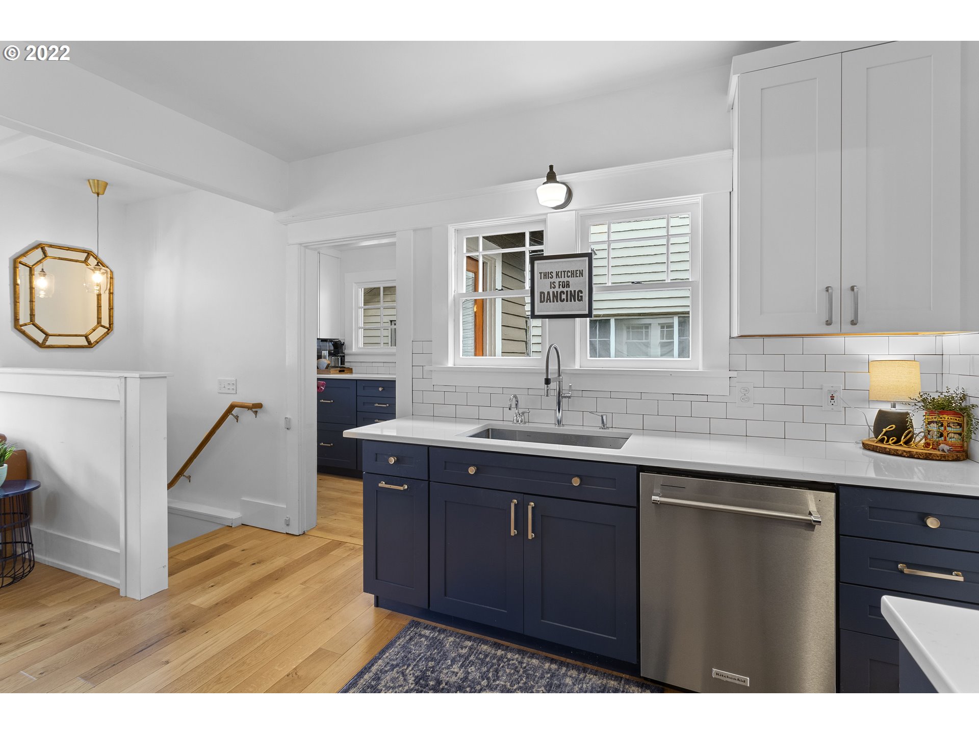 6429 North Commercial Avenue Portland, OR 97217 - Photo 8 of 32 a kitchen with a sink cabinets and window
