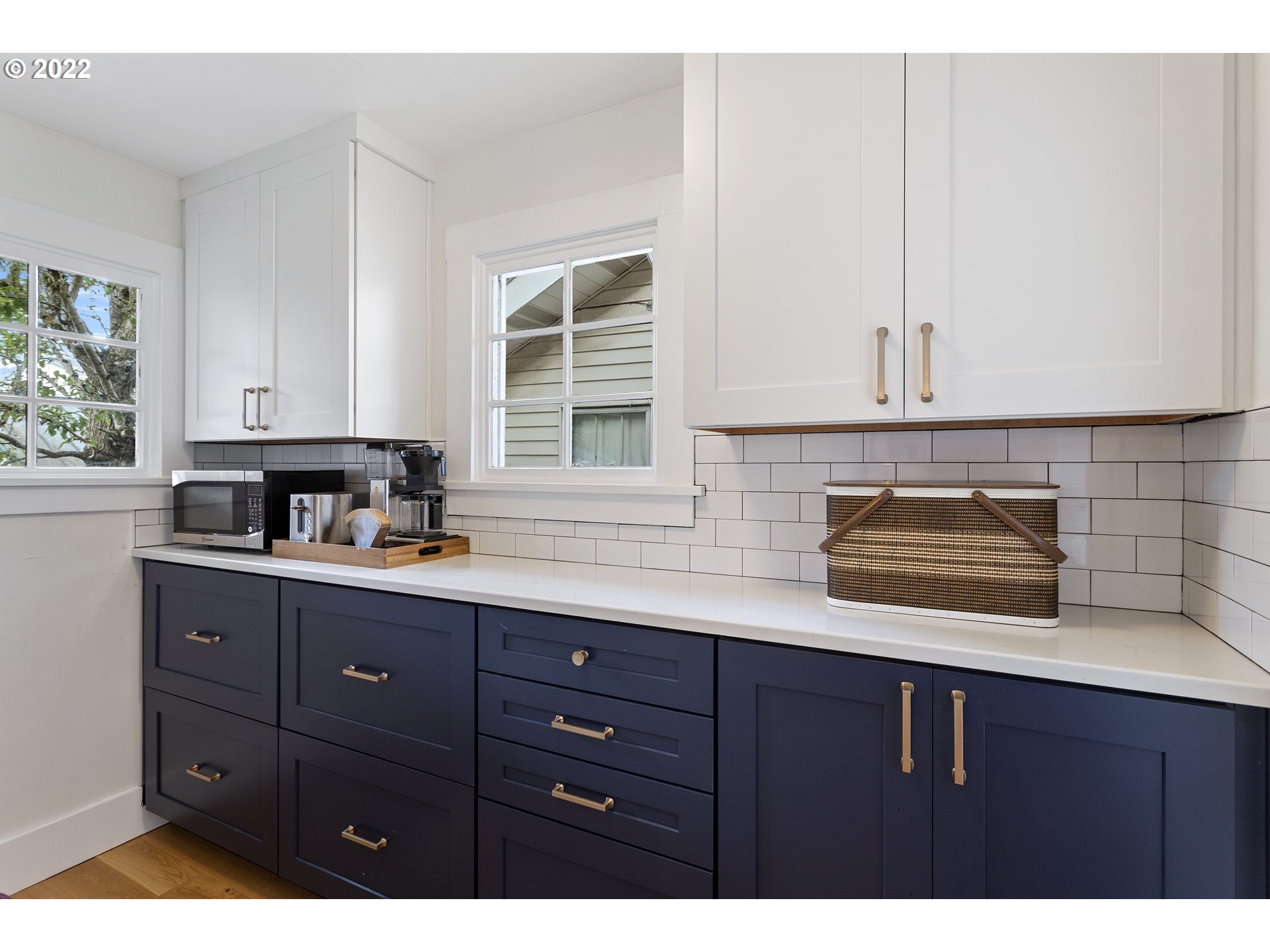 6429 North Commercial Avenue Portland, OR 97217 - Photo 9 of 32 a kitchen with a sink and cabinets
