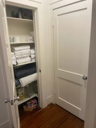 a view of walk in closet with empty racks