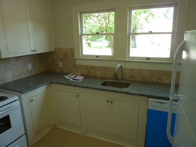 4105 McKinney Street, Unit B Houston, TX 77023 - Photo 25 of 25 a kitchen with a sink and a window