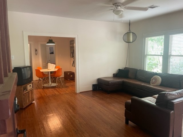 4105 McKinney Street, Unit B Houston, TX 77023 - Photo 10 of 25 a living room with furniture and a wooden floor