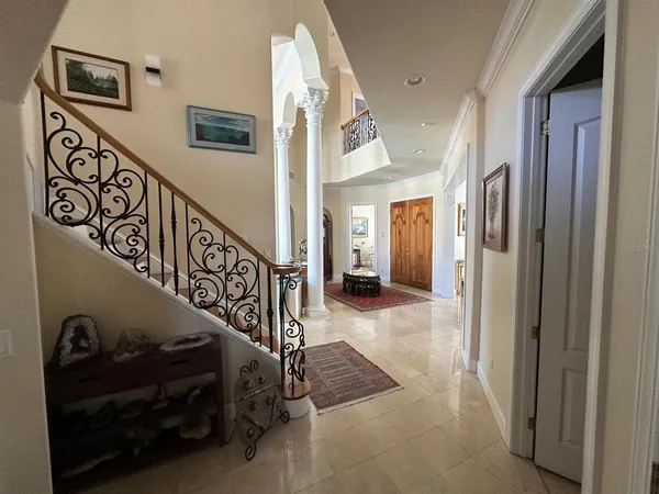a view of a hallway with stairs