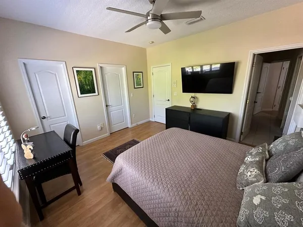 a bedroom with bed and window