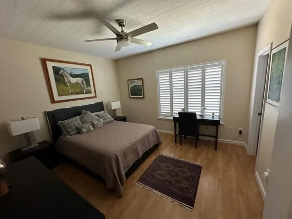 a living room with furniture window and a flat screen tv