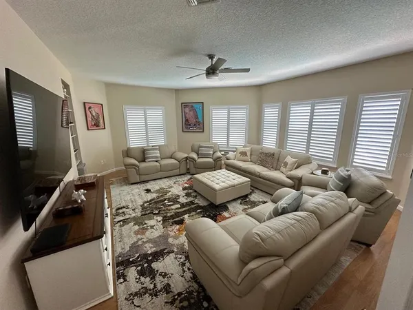 a patio with tables and chairs