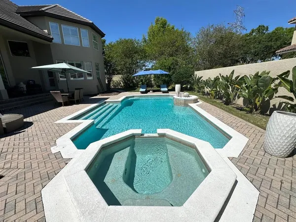 a view of back yard with outdoor seating