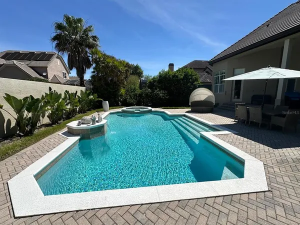 a view of a garden with a large tree