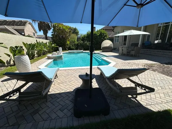 a view of a backyard with large trees