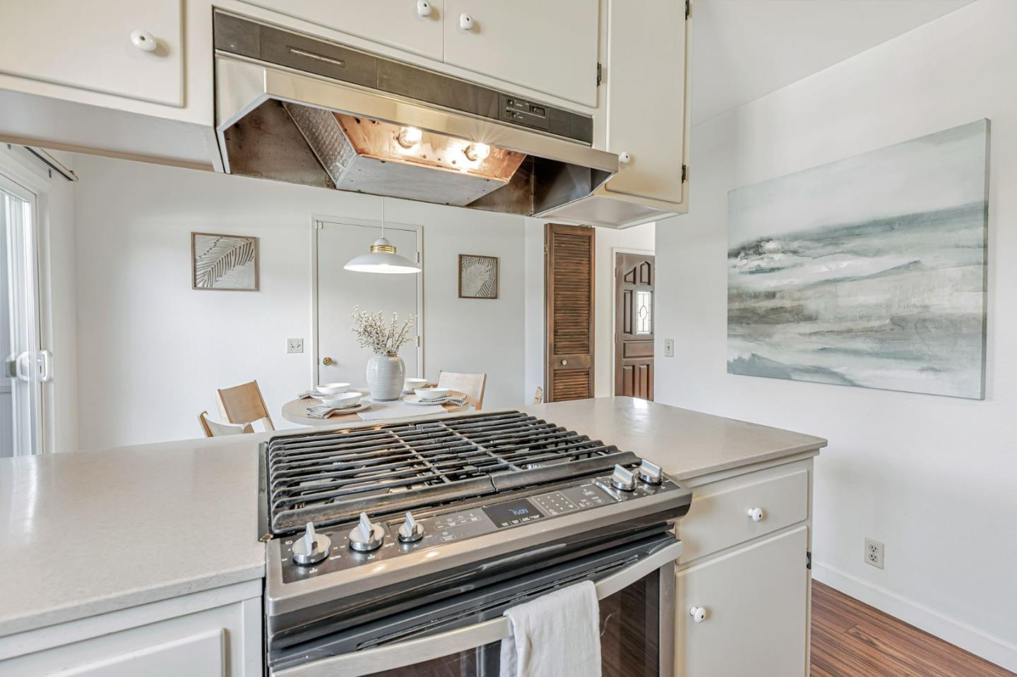 801 Lobos Street Monterey, CA 93940 - Photo 12 of 43 a stove top oven sitting inside of a kitchen