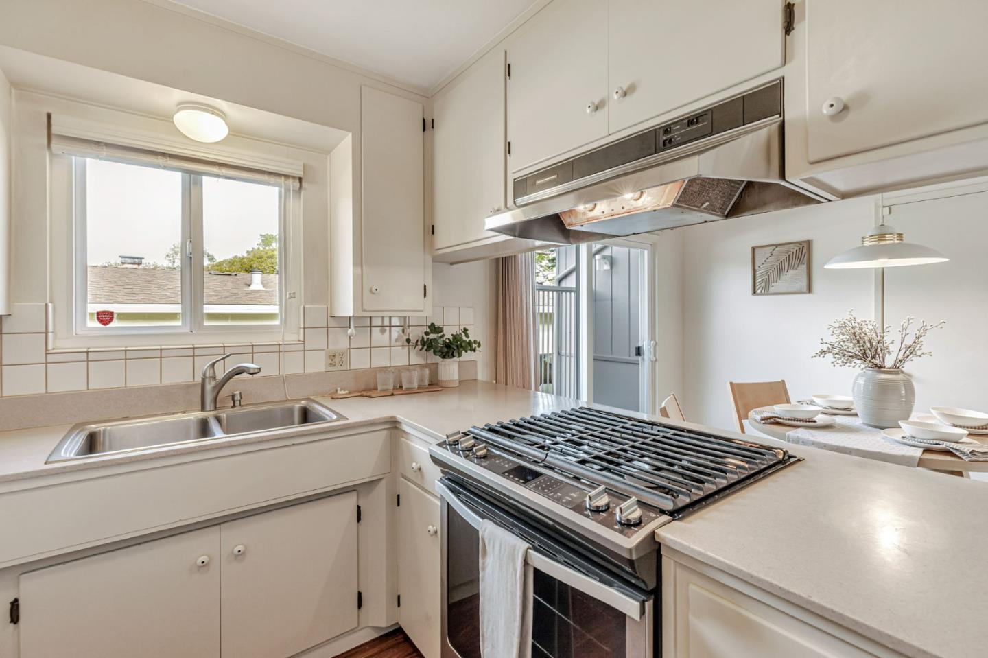 801 Lobos Street Monterey, CA 93940 - Photo 13 of 43 a kitchen with kitchen island a sink stove and a refrigerator