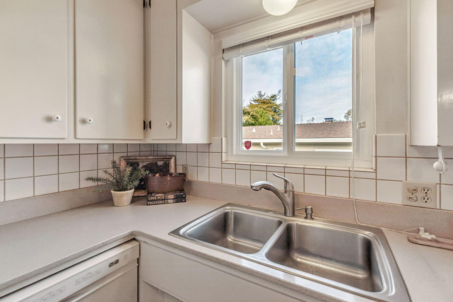 801 Lobos Street Monterey, CA 93940 - Photo 14 of 43 a kitchen with a sink and cabinets
