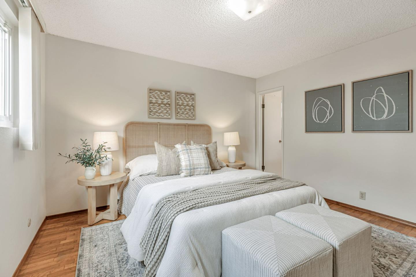 801 Lobos Street Monterey, CA 93940 - Photo 16 of 43 a bedroom with a bed and painting on the wall