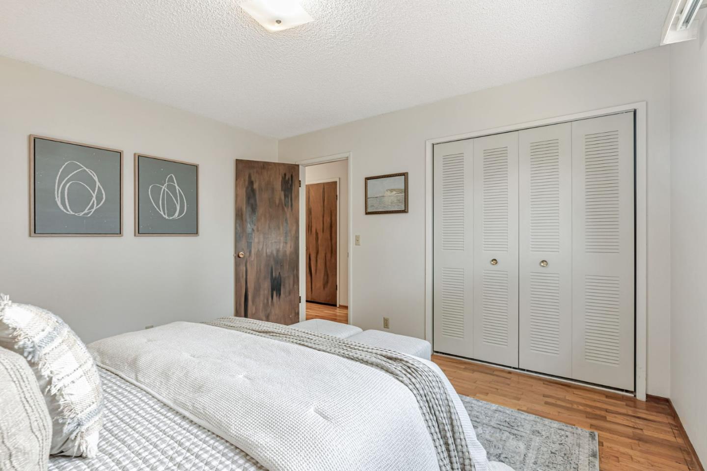 801 Lobos Street Monterey, CA 93940 - Photo 18 of 43 a bedroom with a bed and a walk in closet