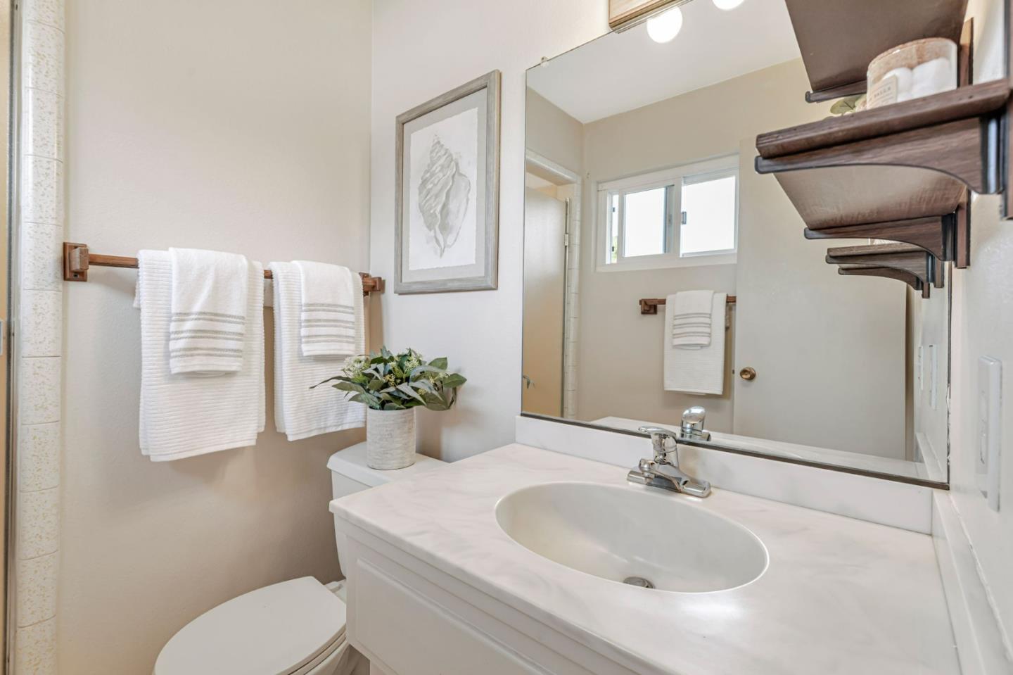 801 Lobos Street Monterey, CA 93940 - Photo 19 of 43 a bathroom with a sink toilet and shower