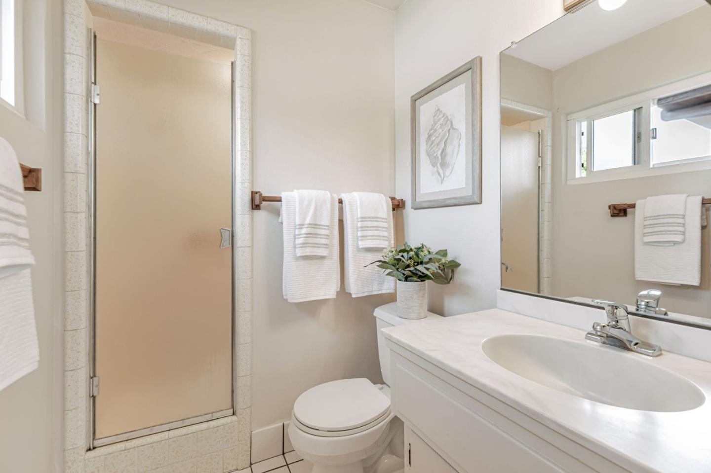 801 Lobos Street Monterey, CA 93940 - Photo 20 of 43 a bathroom with a sink toilet and shower