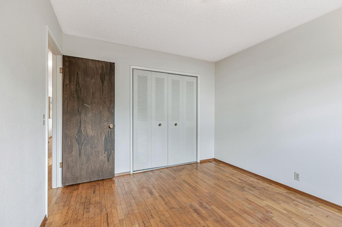 801 Lobos Street Monterey, CA 93940 - Photo 26 of 43 a view of an empty room with wooden floor