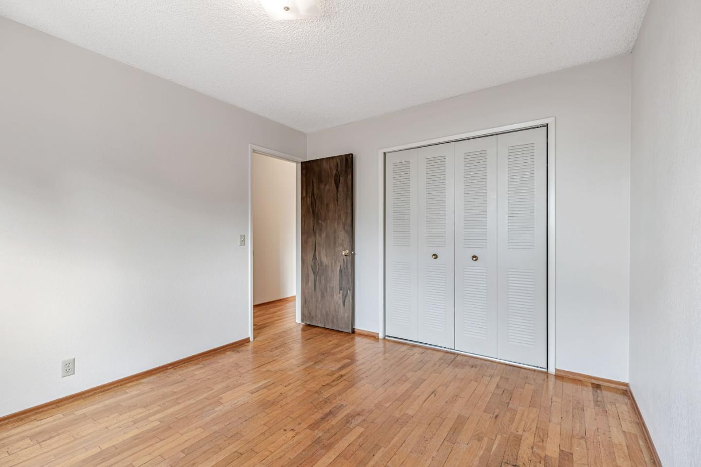 801 Lobos Street Monterey, CA 93940 - Photo 27 of 43 a view of an empty room with wooden floor