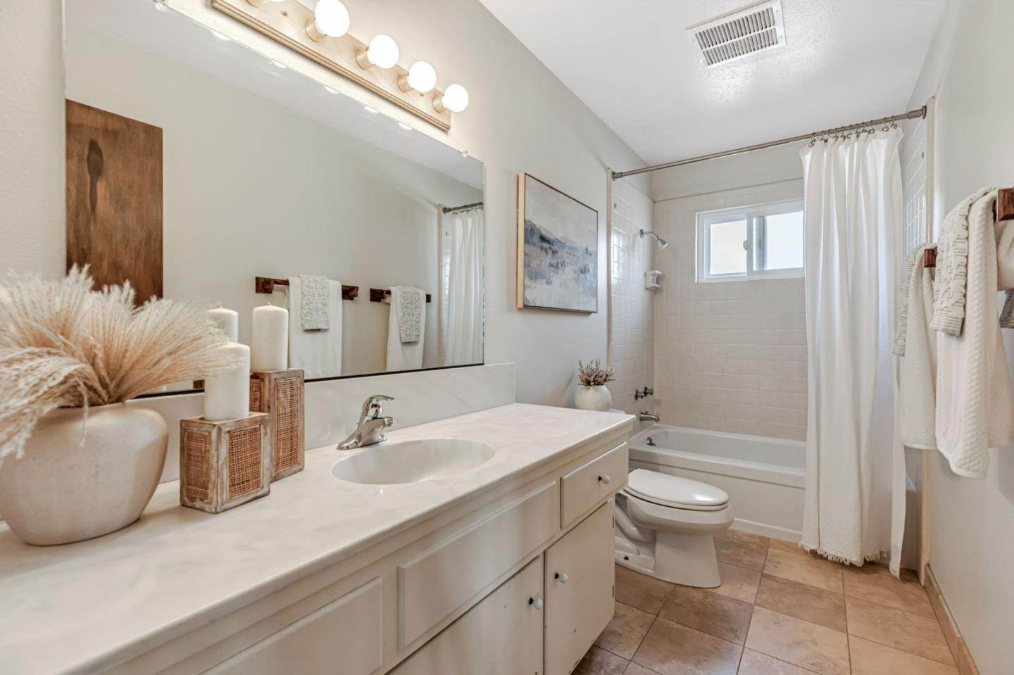 801 Lobos Street Monterey, CA 93940 - Photo 29 of 43 a bathroom with a granite countertop sink mirror vanity bathtub and a toilet
