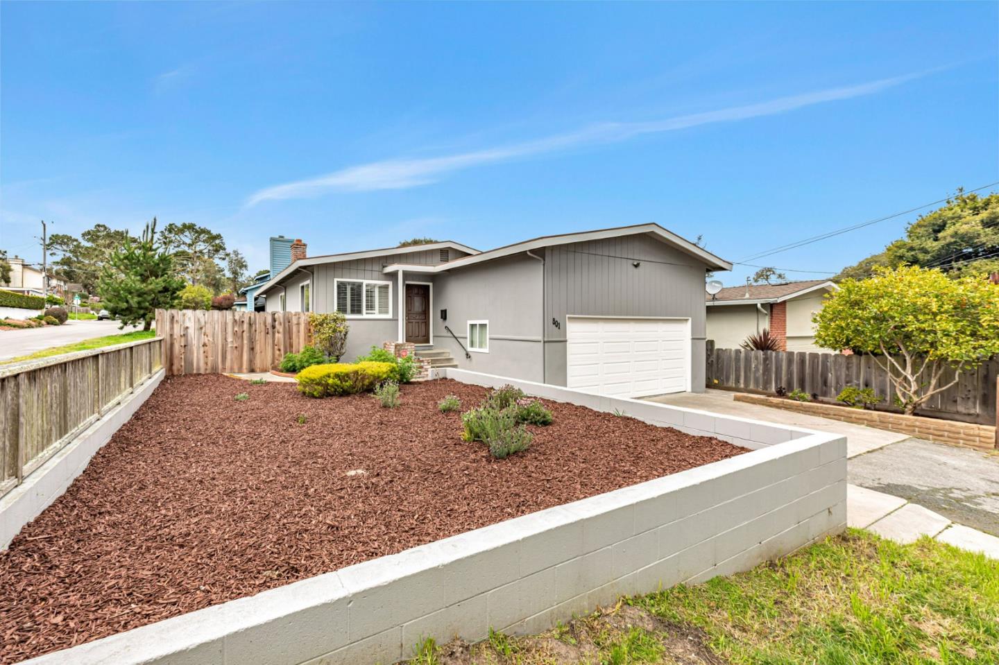 801 Lobos Street Monterey, CA 93940 - Photo 33 of 43 a view of house with backyard and trees