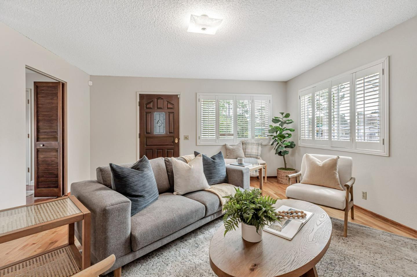 801 Lobos Street Monterey, CA 93940 - Photo 6 of 43 a living room with furniture and a potted plant