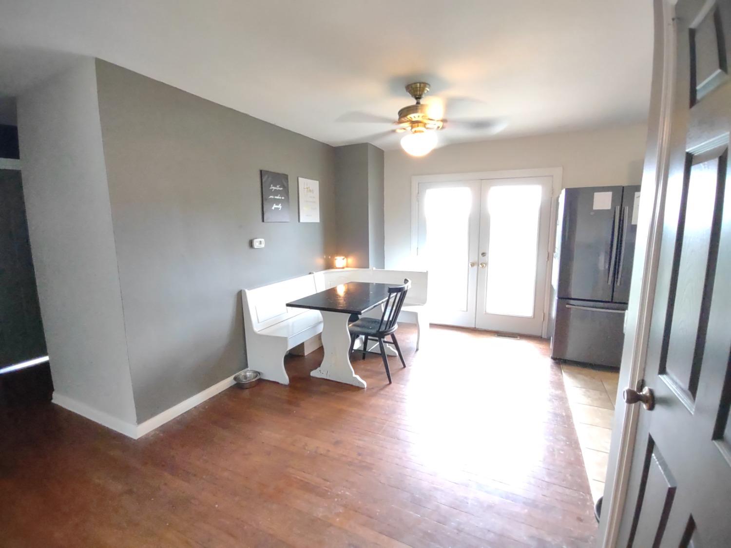 369 Tower Road Lawrenceburg, IN 47025 - Photo 11 of 22 dining area w/ hardwood floors and walk-out to back deck