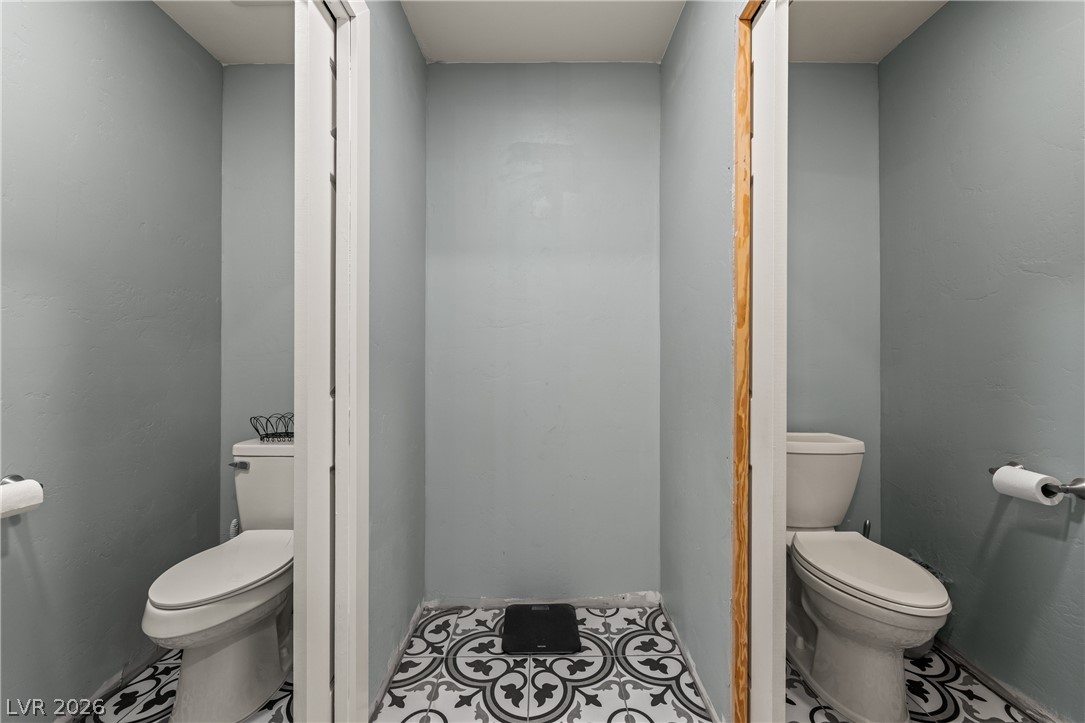 750 Leming Avenue Overton, NV 89040 - Photo 39 of 82 This bathroom showcases elegant tiled flooring and practical commodes for convenience.