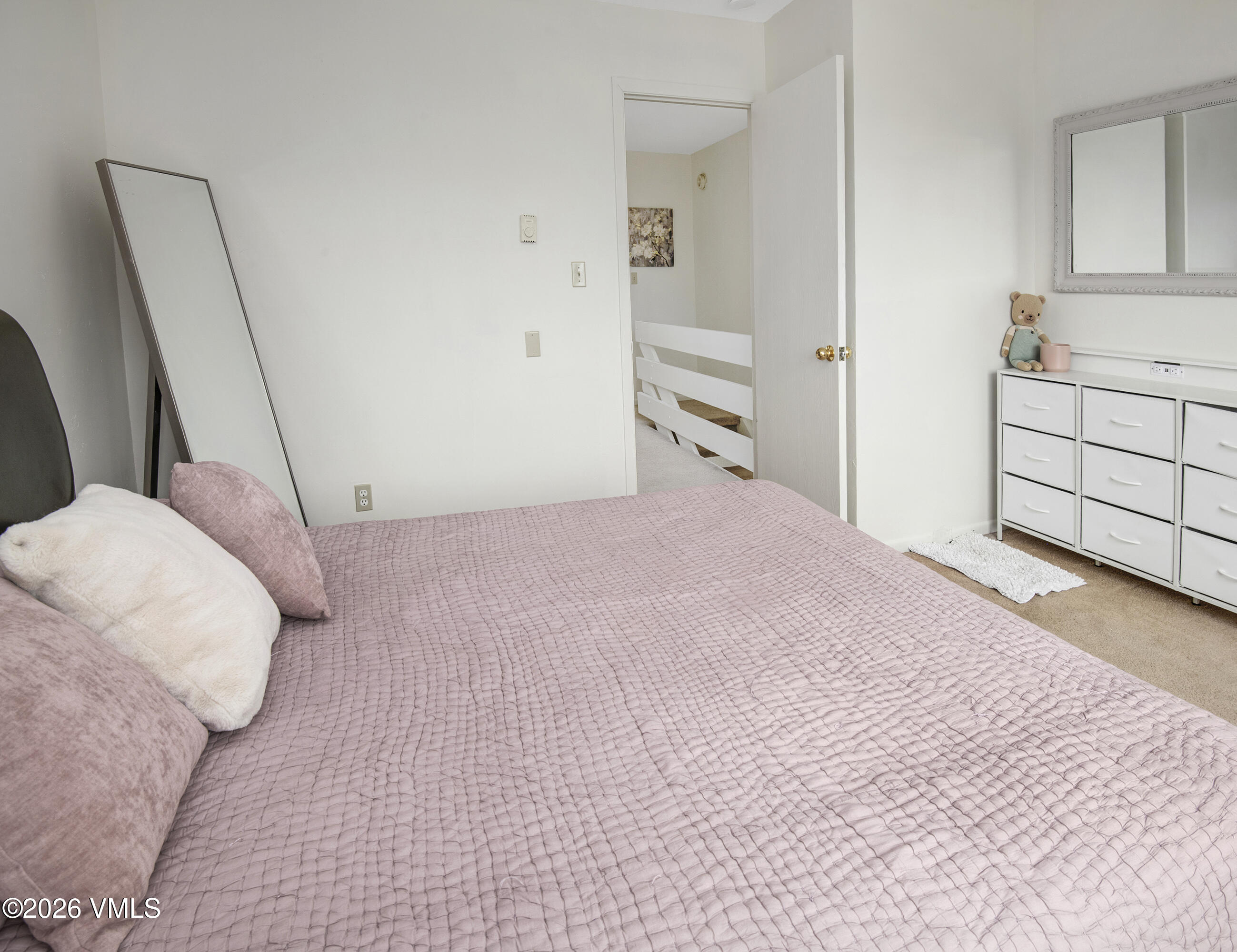 85 Chambers Avenue, Unit 10 Eagle, CO 81631 - Photo 14 of 41 a bedroom with a bed and a cabinets