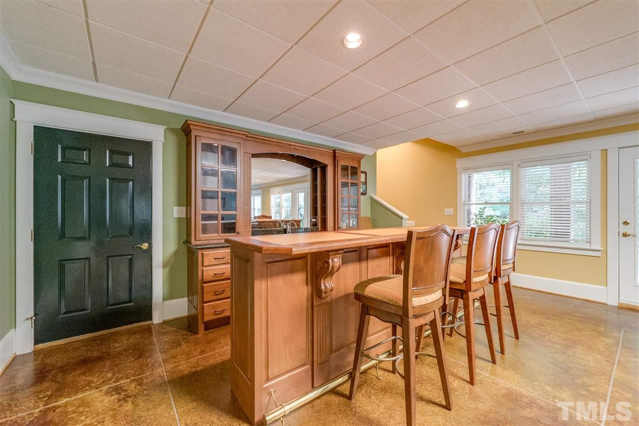 7233 Kemp Road Raleigh, NC 27613 - Photo 14 of 25 a dining room with furniture and window