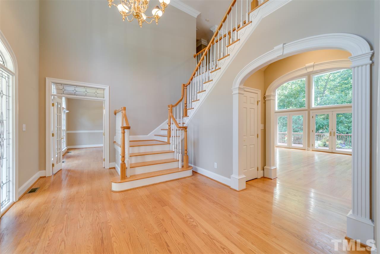 7233 Kemp Road Raleigh, NC 27613 - Photo 3 of 25 a view of entryway and hall with wooden floor