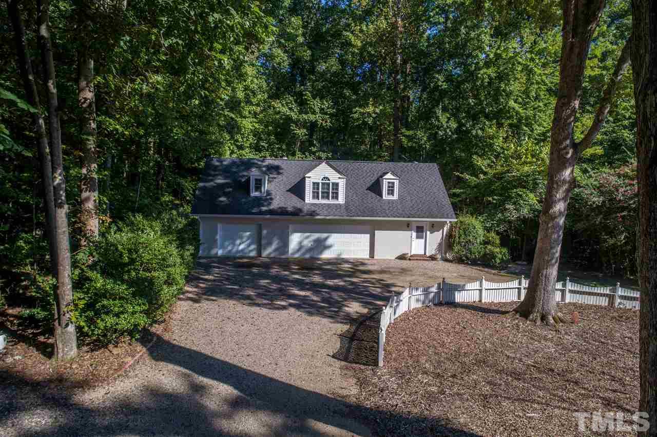 7233 Kemp Road Raleigh, NC 27613 - Photo 22 of 25 front view of a house with a trees