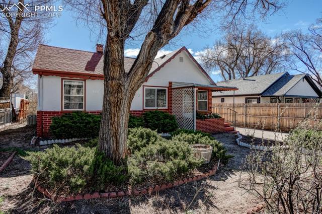 611 Prairie Road Colorado Springs, CO 80909 - Photo 2 of 18 The front yard is fully fenced in.
