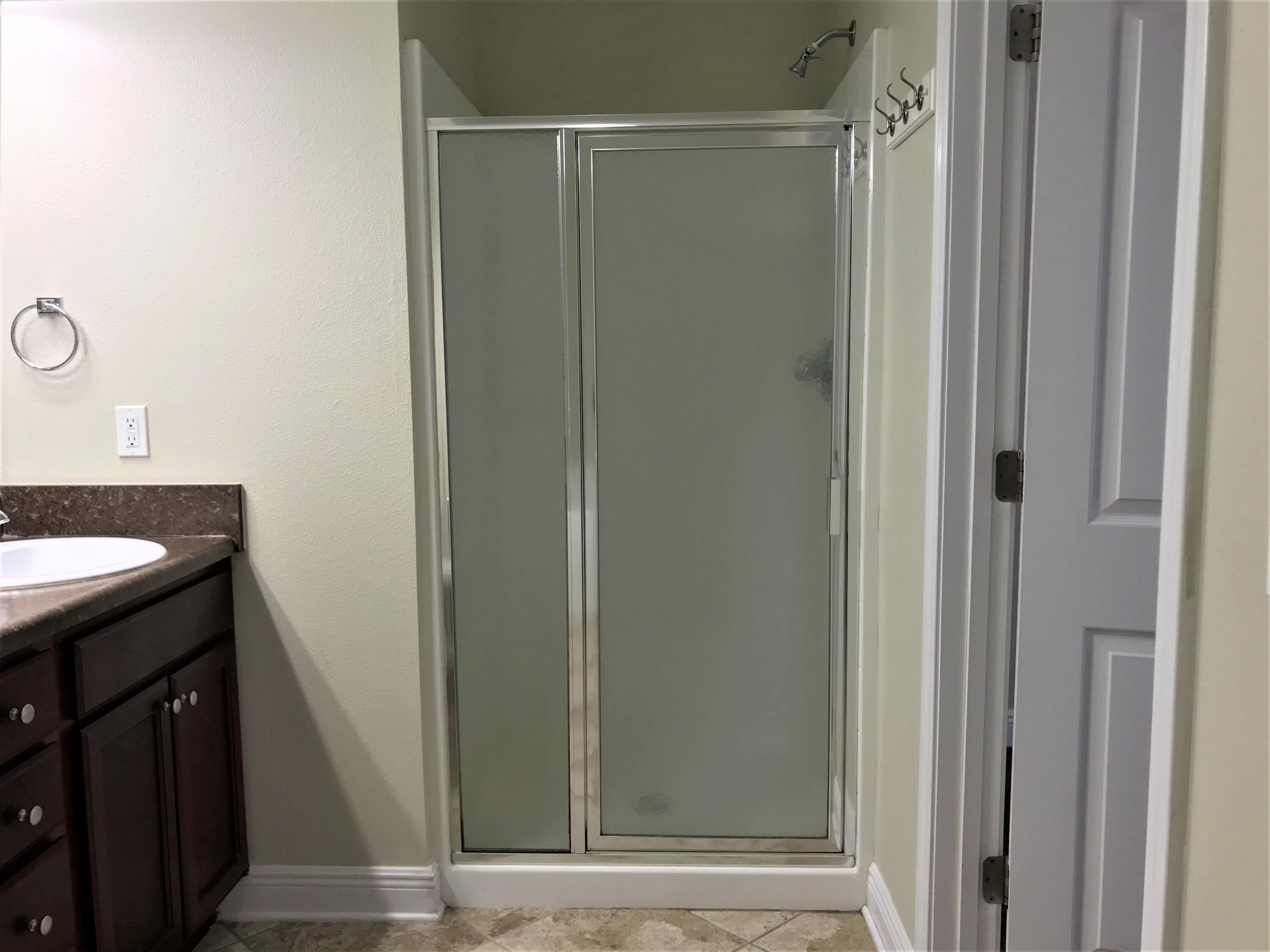 749 Lime Lane Crestview, FL 32536 - Photo 11 of 14 a bathroom with a shower and a sink