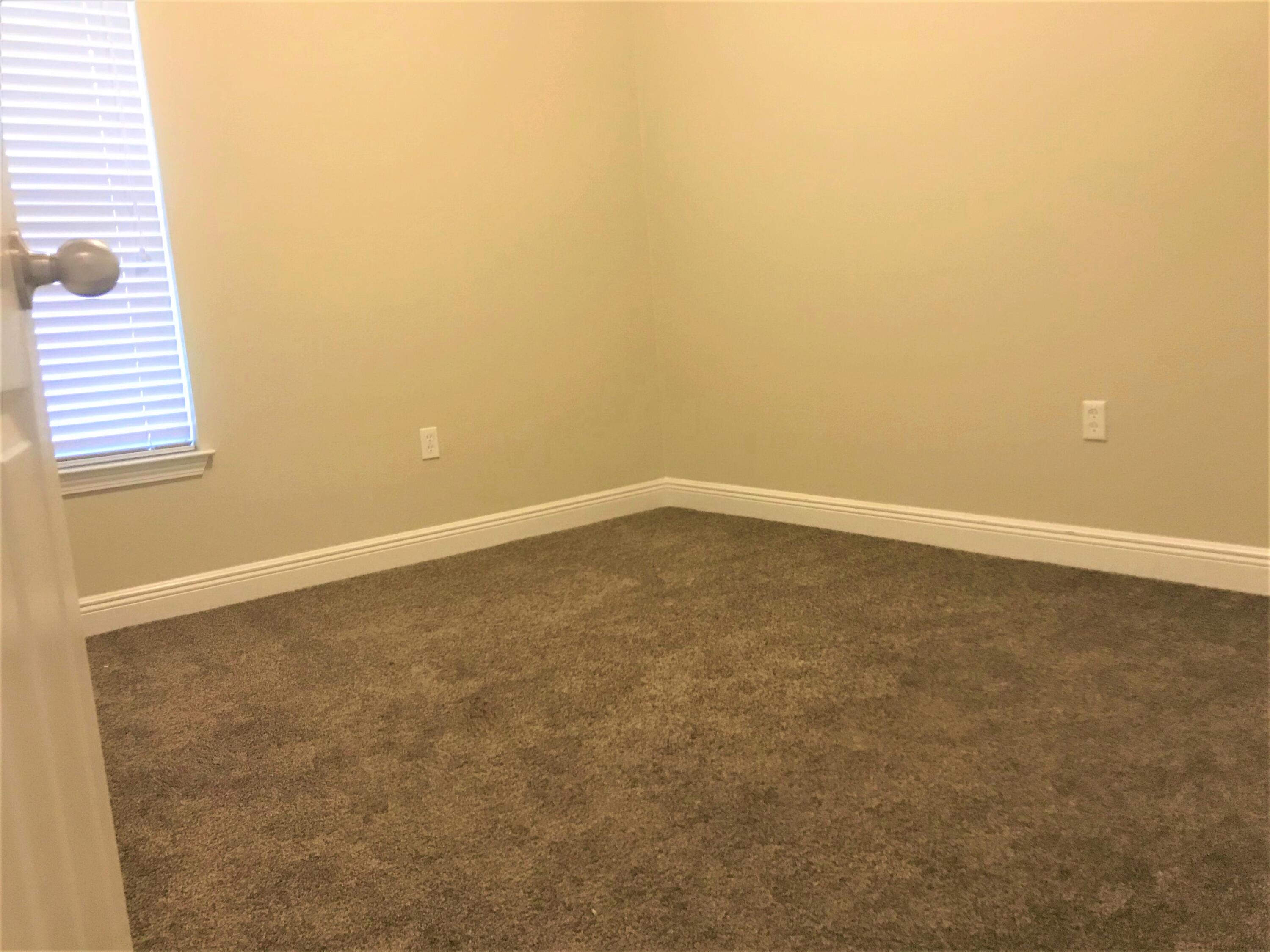 749 Lime Lane Crestview, FL 32536 - Photo 12 of 14 an empty room with windows