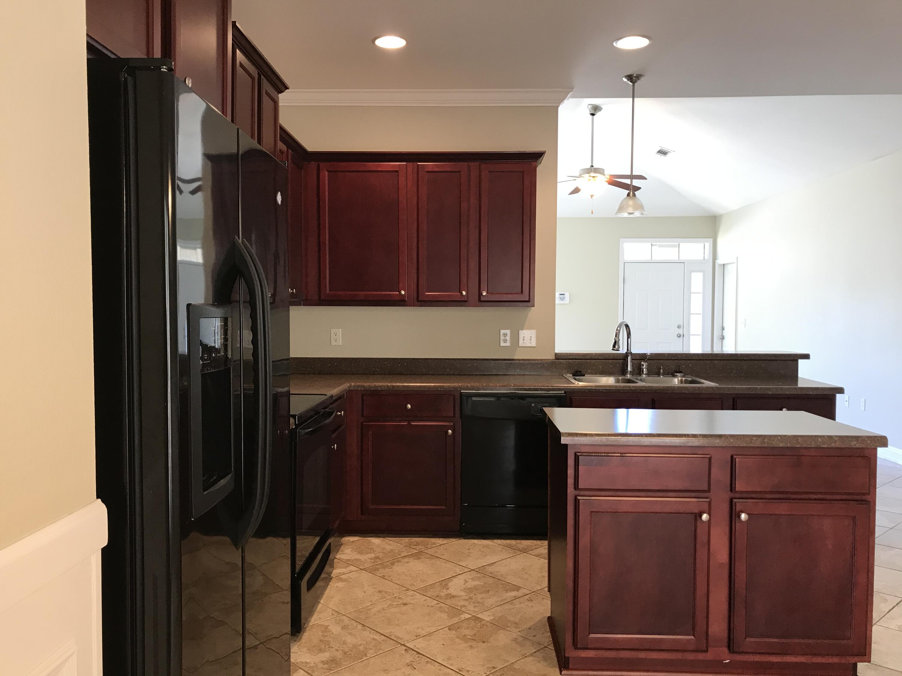 749 Lime Lane Crestview, FL 32536 - Photo 4 of 14 a kitchen with a sink a cabinets and window