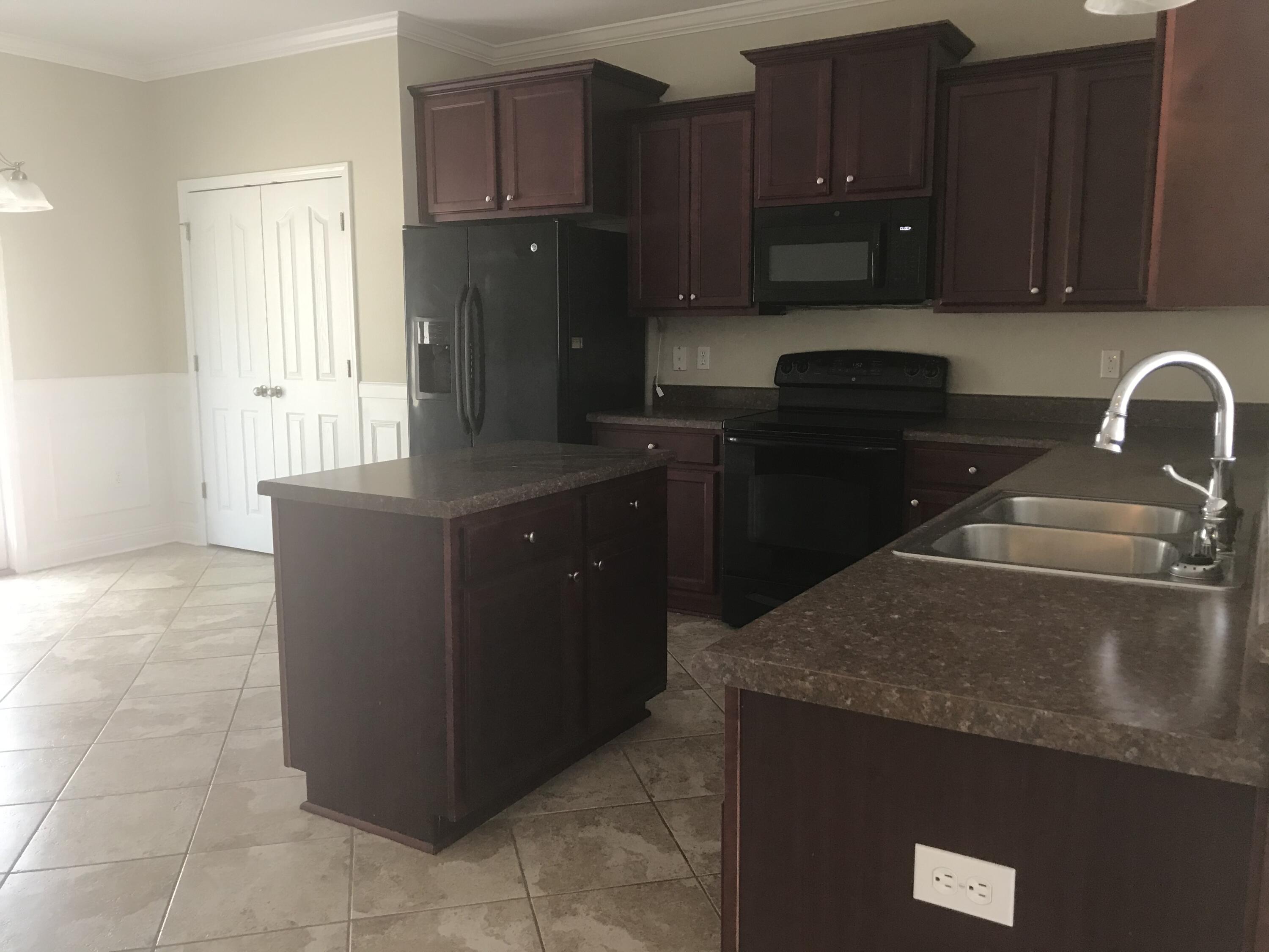 749 Lime Lane Crestview, FL 32536 - Photo 5 of 14 a kitchen with a cabinets and steel appliances