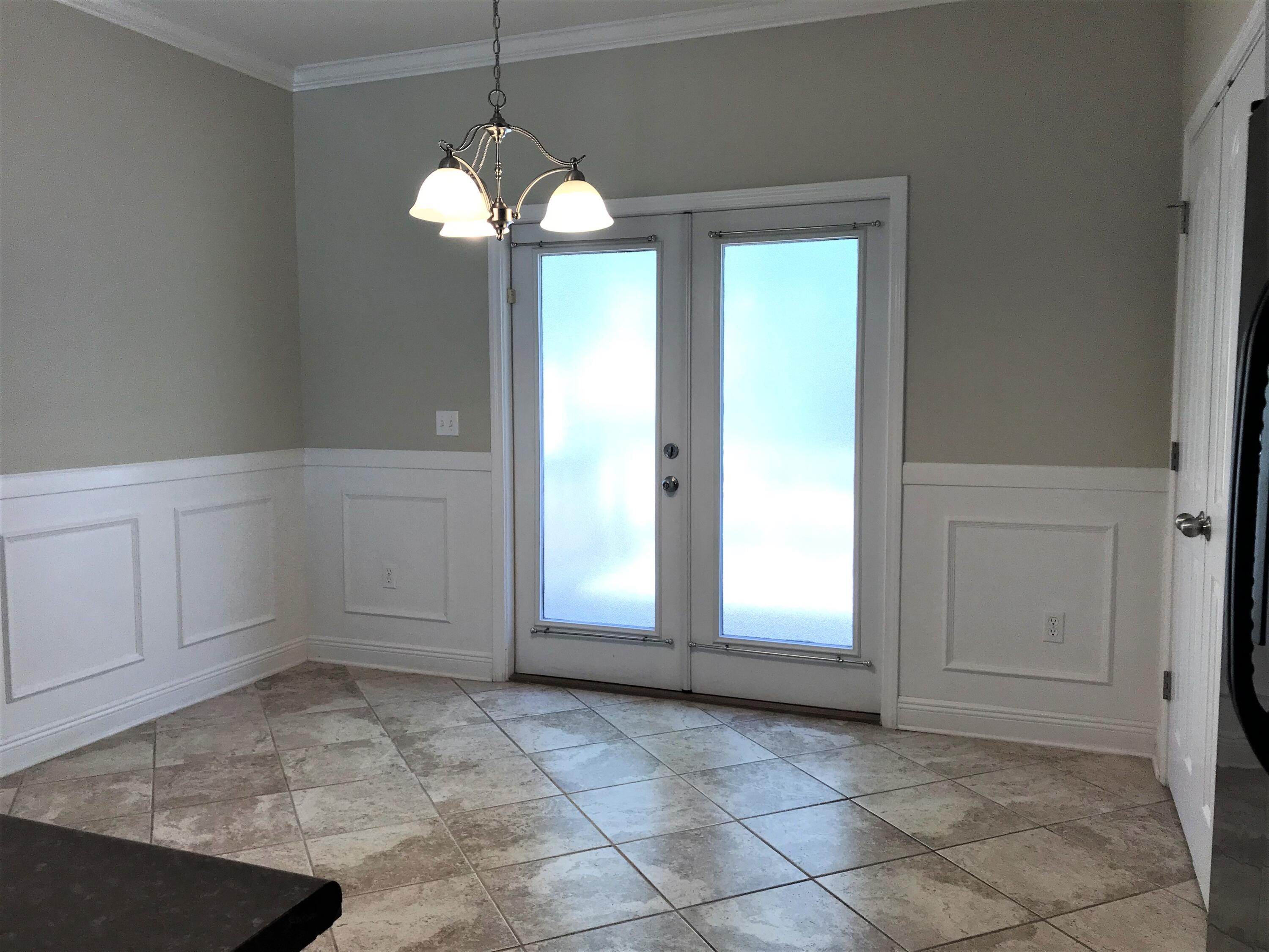 749 Lime Lane Crestview, FL 32536 - Photo 6 of 14 a view of a room with window and chandelier