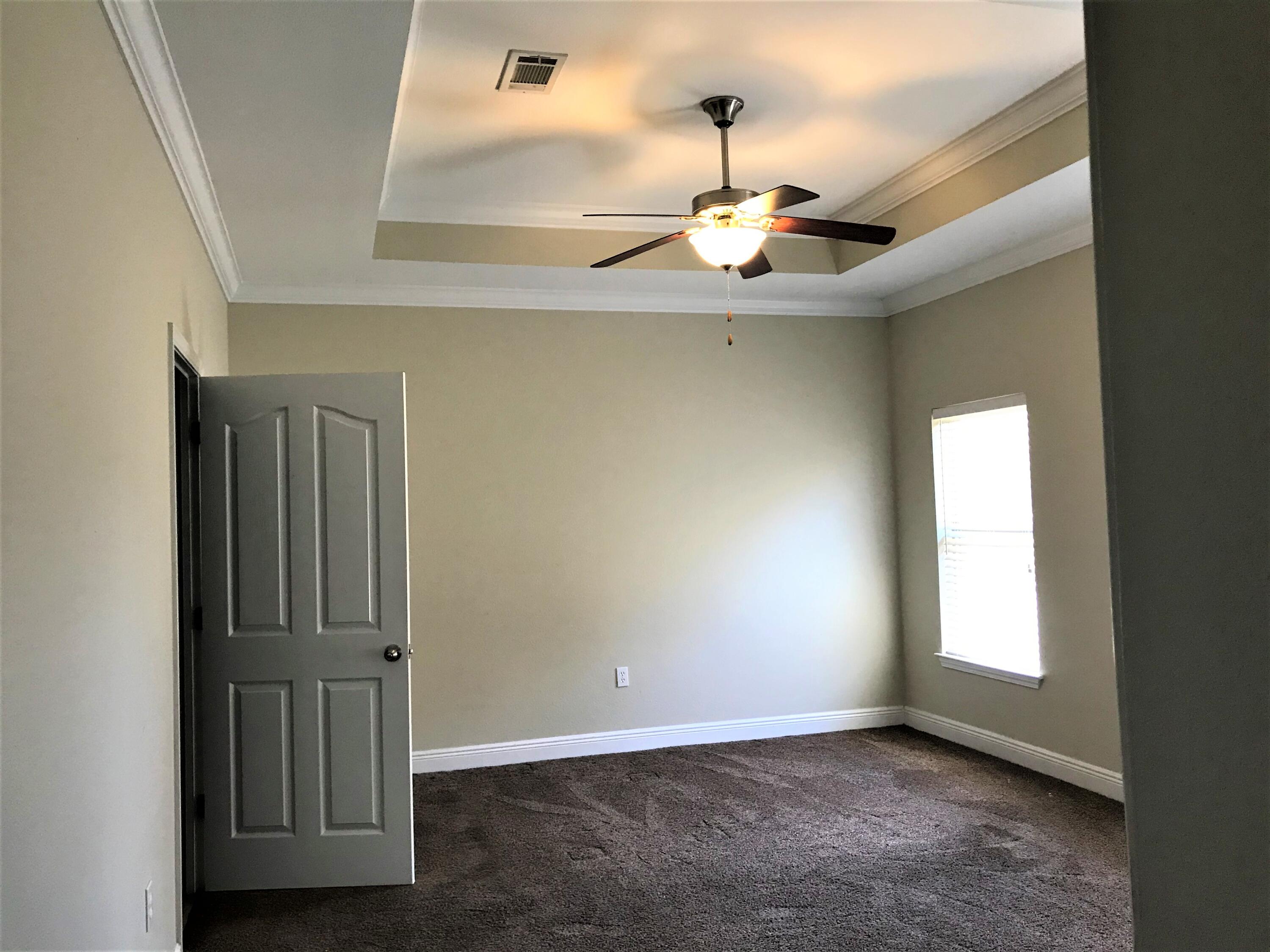 749 Lime Lane Crestview, FL 32536 - Photo 7 of 14 an empty room with windows