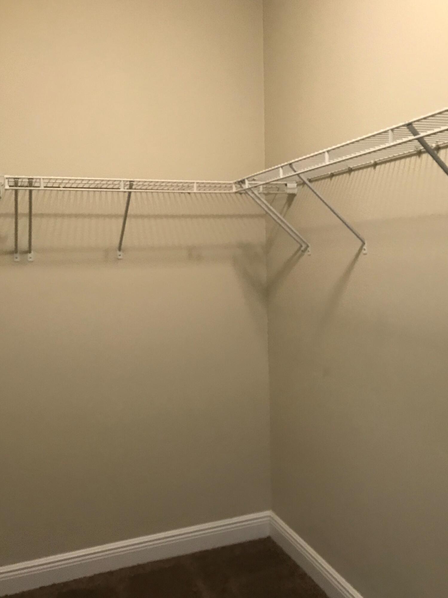 749 Lime Lane Crestview, FL 32536 - Photo 8 of 14 a view of small space with racks on the wall